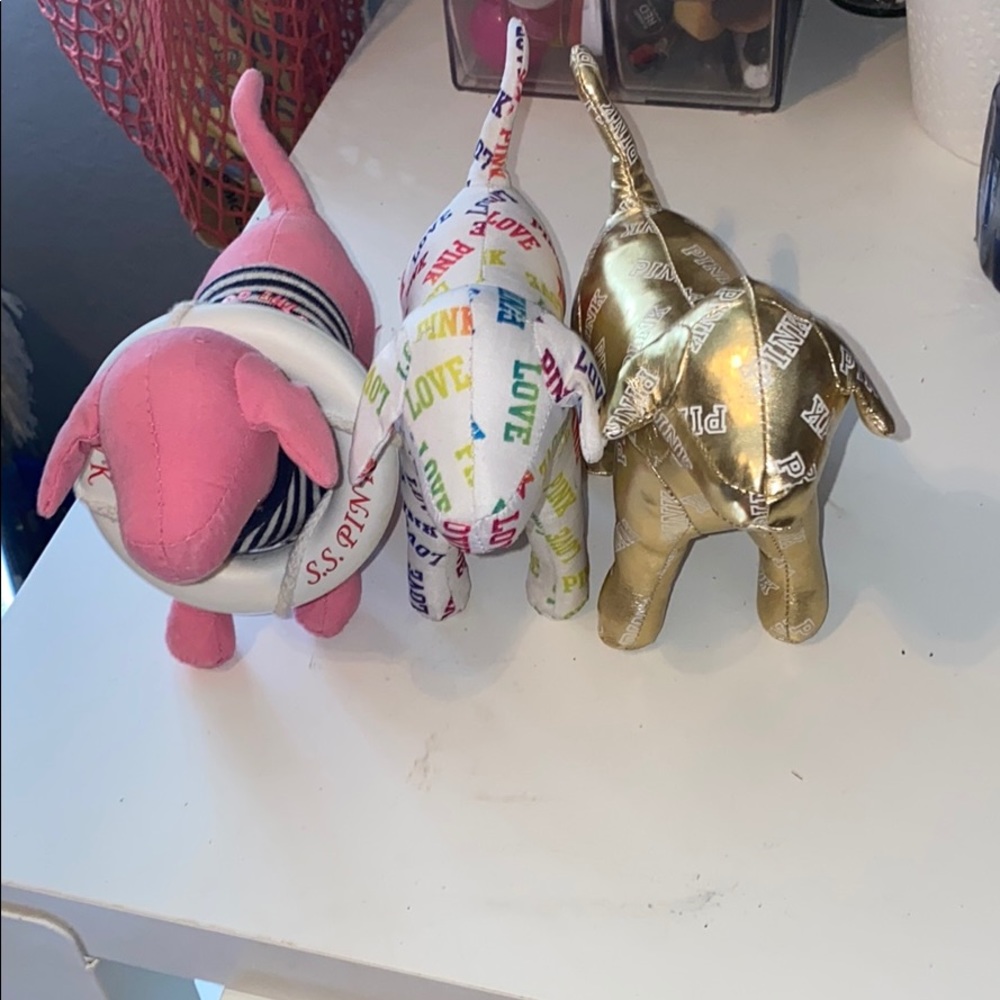 4 Vs pink plush dogs